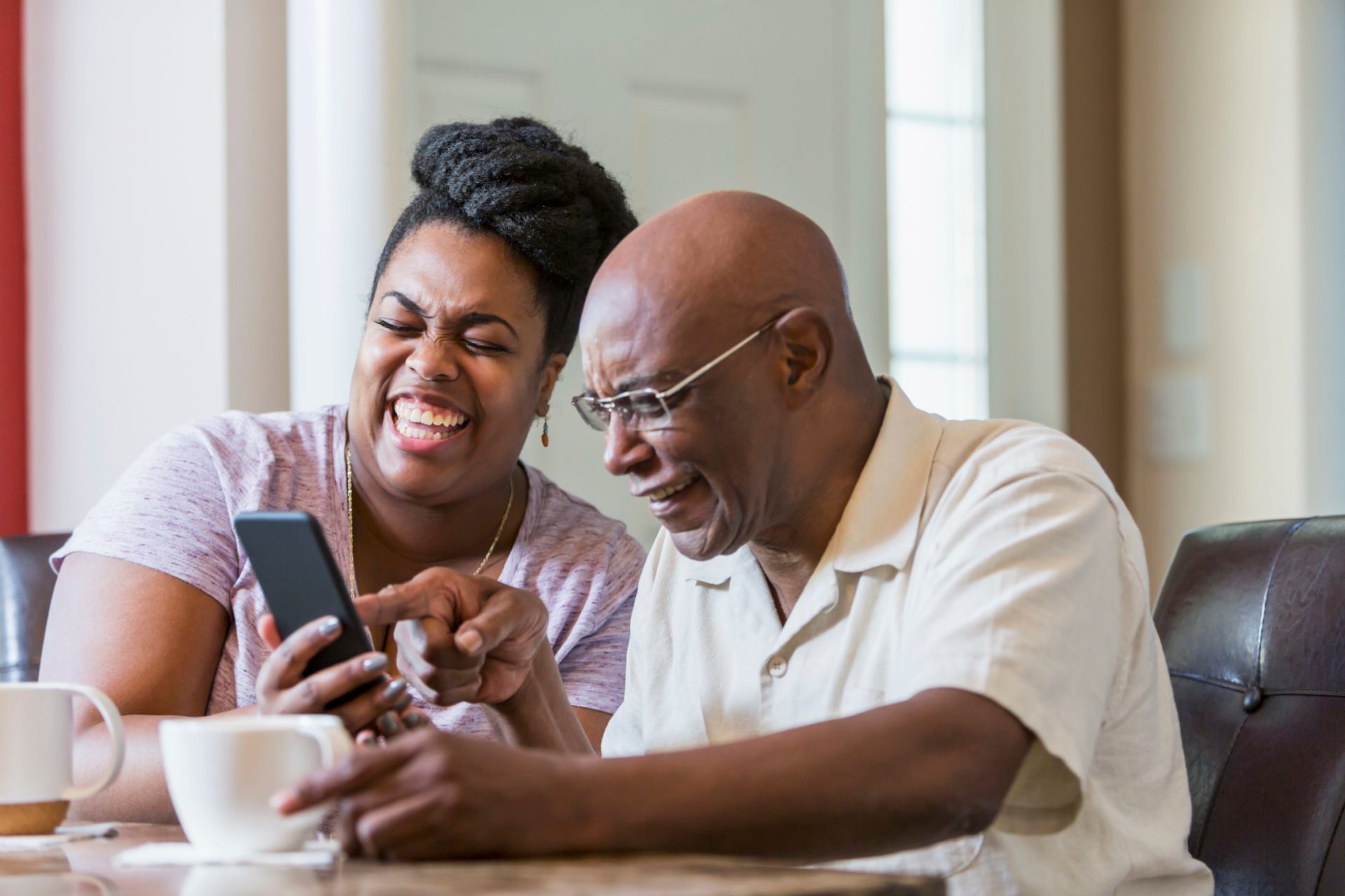 Father with daughter using smart phone